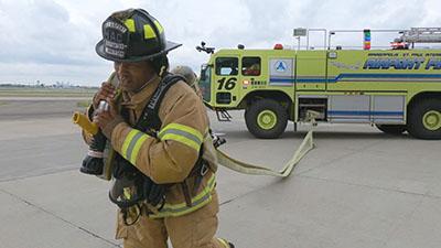 Crash truck and firefighter during an exercise