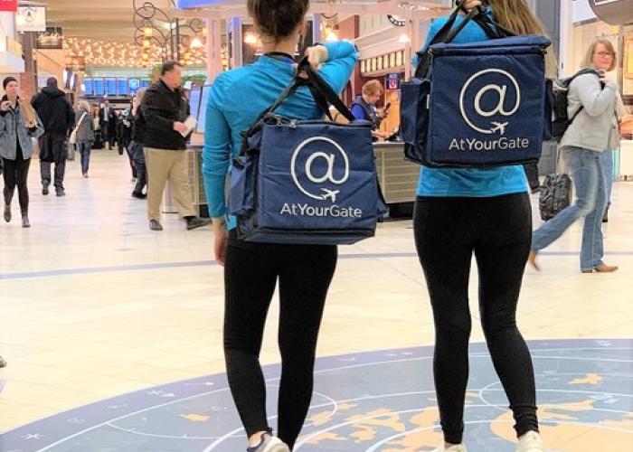 At Your Gate logo on bags