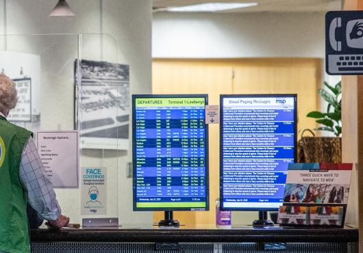 A side-by-side screen displays text of audible announcements 